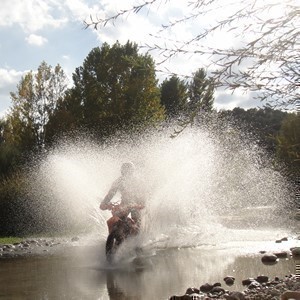 Crossing the River Matarraña by offroad motorcycle with TrailbikeTours